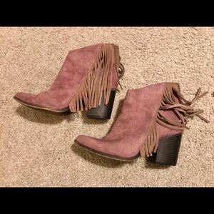 Beige heeled ankle booties with fringe